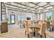Community room with tables, chairs, and modern light fixtures at 5322 Windy Grove Dr, Wimauma, FL 33598