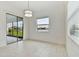 Bright dining area with lake view and sliding glass doors at 5322 Windy Grove Dr, Wimauma, FL 33598