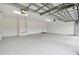 Large two-car garage with high ceilings and ample space at 5322 Windy Grove Dr, Wimauma, FL 33598