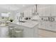 Modern kitchen with white cabinets and center island at 5322 Windy Grove Dr, Wimauma, FL 33598