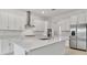 Modern kitchen with white cabinets, stainless steel appliances, and large island at 5322 Windy Grove Dr, Wimauma, FL 33598