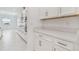 White kitchen with quartz countertops and stainless steel appliances at 5322 Windy Grove Dr, Wimauma, FL 33598