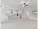 Modern kitchen with island and stainless steel appliances at 5322 Windy Grove Dr, Wimauma, FL 33598