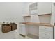 Laundry room with cabinets, countertop, and storage at 5322 Windy Grove Dr, Wimauma, FL 33598