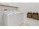 Laundry room with washer, dryer, and storage cabinets at 5322 Windy Grove Dr, Wimauma, FL 33598