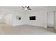 Spacious living room featuring light flooring and neutral walls at 5322 Windy Grove Dr, Wimauma, FL 33598