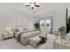 Spacious main bedroom with a king-size bed and large windows at 5322 Windy Grove Dr, Wimauma, FL 33598