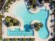 Large community pool with lap lanes and lounging areas at 5322 Windy Grove Dr, Wimauma, FL 33598