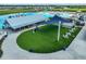Relaxing poolside space with shade structure and seating at 5322 Windy Grove Dr, Wimauma, FL 33598