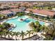 Aerial view of resort-style pool with lounge chairs at 5322 Windy Grove Dr, Wimauma, FL 33598