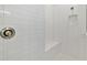 Walk-in shower with built-in seat and white subway tile at 5322 Windy Grove Dr, Wimauma, FL 33598