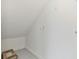 Empty storage room with sloped ceilings and hooks on the wall at 5322 Windy Grove Dr, Wimauma, FL 33598