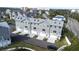 Aerial view of townhouses, gray siding, white trim, and gray roofs at 5736 Biscayne Ct # 3, New Port Richey, FL 34652