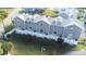 Aerial view of townhouses, showing layout and landscaping at 5736 Biscayne Ct # 3, New Port Richey, FL 34652