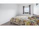 Bright bedroom with a double bed and window at 5736 Biscayne Ct # 3, New Port Richey, FL 34652
