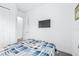 Simple bedroom with a single bed and TV at 5736 Biscayne Ct # 3, New Port Richey, FL 34652