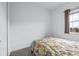 Cozy bedroom with a double bed and window at 5736 Biscayne Ct # 3, New Port Richey, FL 34652