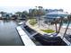 Aerial view of community pool, dock, and clubhouse at 5736 Biscayne Ct # 3, New Port Richey, FL 34652