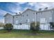 Rear view of townhouses with private yards at 5736 Biscayne Ct # 3, New Port Richey, FL 34652