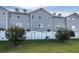 Rear view of townhouses with private yards at 5736 Biscayne Ct # 3, New Port Richey, FL 34652