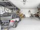 Two-car garage with golf cart and storage at 5736 Biscayne Ct # 3, New Port Richey, FL 34652