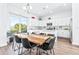 Modern kitchen featuring white cabinets, stainless steel appliances, and an island at 5736 Biscayne Ct # 3, New Port Richey, FL 34652