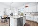 Modern kitchen with island, stainless steel appliances, and white cabinetry at 5736 Biscayne Ct # 3, New Port Richey, FL 34652