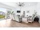 Spacious living room with hardwood floors, fireplace, and balcony access at 5736 Biscayne Ct # 3, New Port Richey, FL 34652