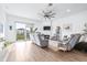 Living room with hardwood floors, fireplace, and comfortable couches at 5736 Biscayne Ct # 3, New Port Richey, FL 34652