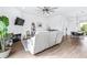 Living room with hardwood floors, fireplace, and grey couches at 5736 Biscayne Ct # 3, New Port Richey, FL 34652
