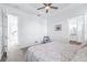 Spacious main bedroom with ceiling fan and en-suite bathroom at 5736 Biscayne Ct # 3, New Port Richey, FL 34652