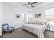 Spacious main bedroom with ceiling fan and en-suite bathroom at 5736 Biscayne Ct # 3, New Port Richey, FL 34652