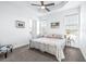 Spacious main bedroom with ceiling fan and en-suite bathroom at 5736 Biscayne Ct # 3, New Port Richey, FL 34652