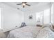 Spacious main bedroom with ceiling fan and en-suite bathroom at 5736 Biscayne Ct # 3, New Port Richey, FL 34652