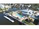 Inviting community pool with ample lounge chairs and waterfront access at 5736 Biscayne Ct # 3, New Port Richey, FL 34652