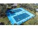Well-lit, four-court tennis complex with surrounding green space at 5736 Biscayne Ct # 3, New Port Richey, FL 34652
