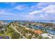 Aerial view of waterfront homes with lush landscaping and private boat docks at 670 Island Way # 500, Clearwater Beach, FL 33767