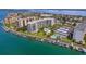 Aerial view of Sunwatch, a waterfront community with tennis courts, pool, and boat slips at 670 Island Way # 500, Clearwater Beach, FL 33767
