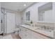 Bathroom with double vanity, granite countertops, and a large mirror at 670 Island Way # 500, Clearwater Beach, FL 33767