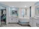 Clean bathroom with a freestanding tub and double vanity at 670 Island Way # 500, Clearwater Beach, FL 33767