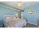 Primary bedroom with a king-size bed and light teal walls at 670 Island Way # 500, Clearwater Beach, FL 33767