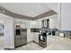 Bright kitchen with stainless steel appliances and white cabinetry at 670 Island Way # 500, Clearwater Beach, FL 33767