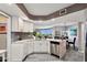 Modern white kitchen with stainless steel appliances and granite countertops at 670 Island Way # 500, Clearwater Beach, FL 33767