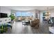 Spacious living room with water views, hardwood floors, and ample natural light at 670 Island Way # 500, Clearwater Beach, FL 33767