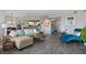 Open concept living room with kitchen access and comfortable seating at 670 Island Way # 500, Clearwater Beach, FL 33767