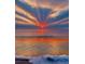 Spectacular oceanfront property showcasing a vibrant sunset over the water at 670 Island Way # 500, Clearwater Beach, FL 33767