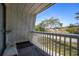 Private balcony overlooking a tree-lined street at 705 Whiteway Dr, Brooksville, FL 34601