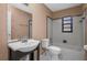 Clean bathroom with a tub, toilet and sink at 705 Whiteway Dr, Brooksville, FL 34601