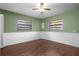 Cozy bedroom with ceiling fan and wood-look flooring at 705 Whiteway Dr, Brooksville, FL 34601