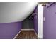 Small closet with purple walls and wood flooring at 705 Whiteway Dr, Brooksville, FL 34601